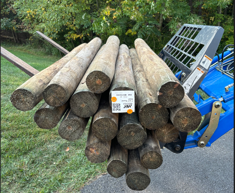 Fence posts on a forklift