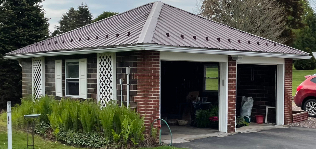 metal pyramid shaped roof with snowbirds