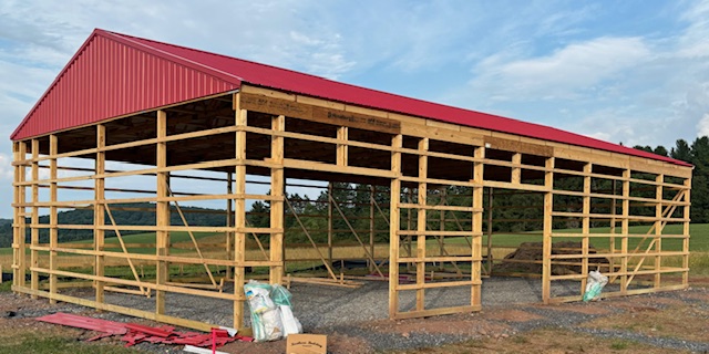 Framed pole barn with exposed girts